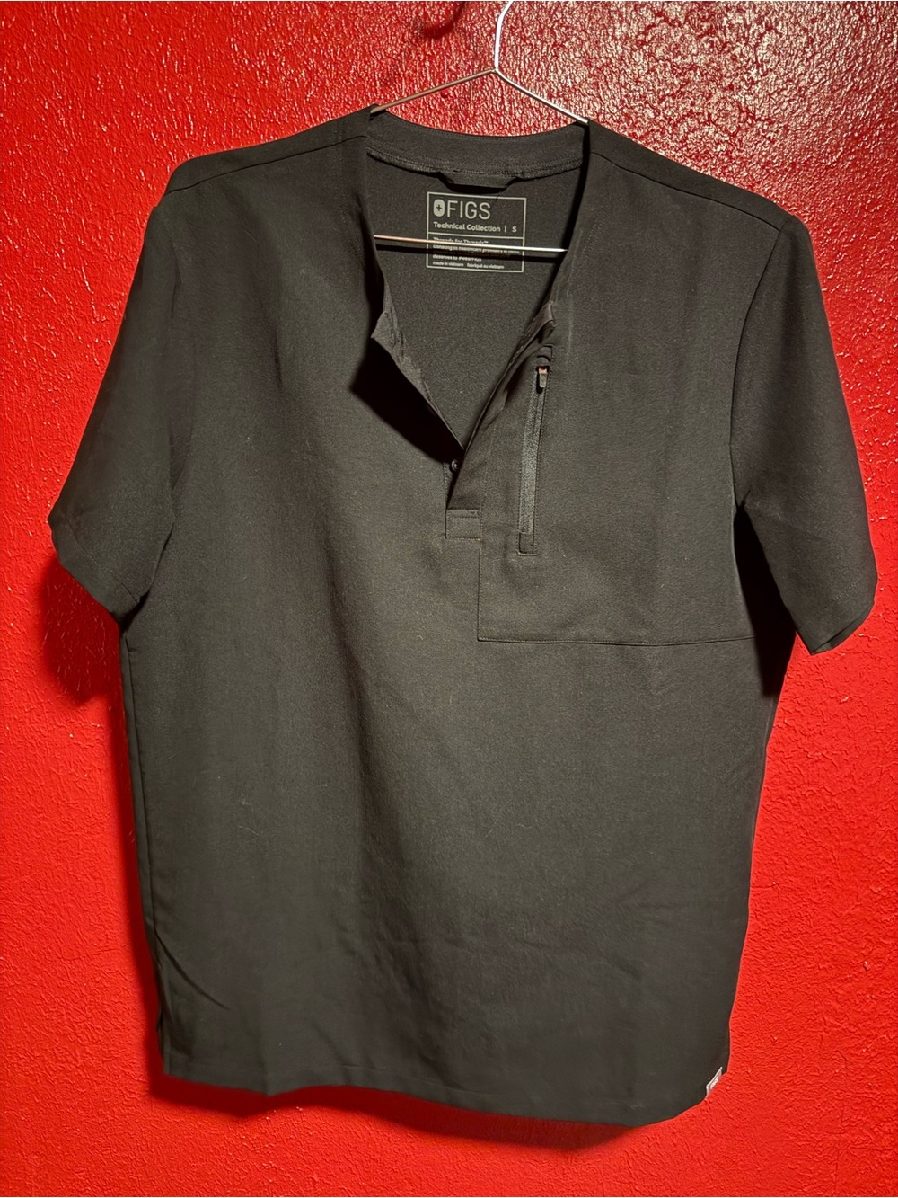 126. Pre loved FIGS Woman’s Black Short Sleeve Scrub Top with Zip Chest Pocket